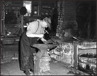 Figure 4. Leonard Estabrooks (1884–1968) in his shop in Middle Sackville, c. 1960, working on a dyking spade.